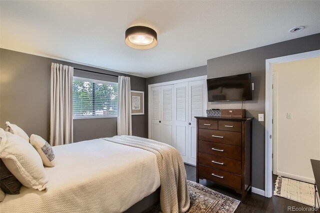 7036 Robb St, Arvada, CO 80004 - bedroom with dark wood-style floors and a closet