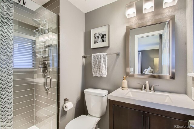 7036 Robb St, Arvada, CO 80004 - full bathroom with vanity and a stall shower