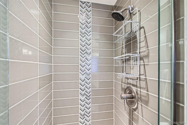 7036 Robb St, Arvada, CO 80004 - full bathroom featuring a tile shower