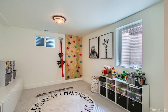 7036 Robb St, Arvada, CO 80004 - playroom with healthy amount of natural light and carpet