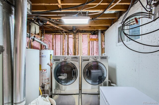 7036 Robb St, Arvada, CO 80004 - laundry room with gas water heater, water heater, and separate washer and dryer
