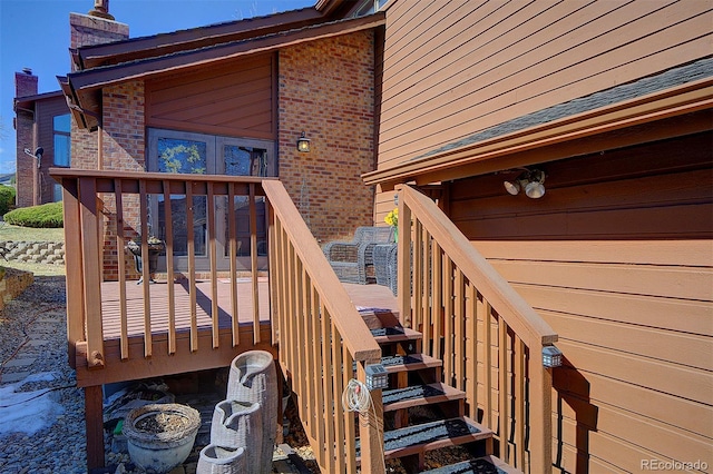 wooden terrace featuring stairs