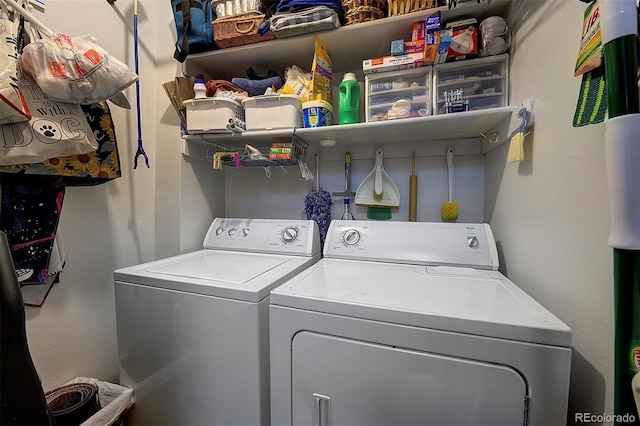 clothes washing area with laundry area and washer and clothes dryer