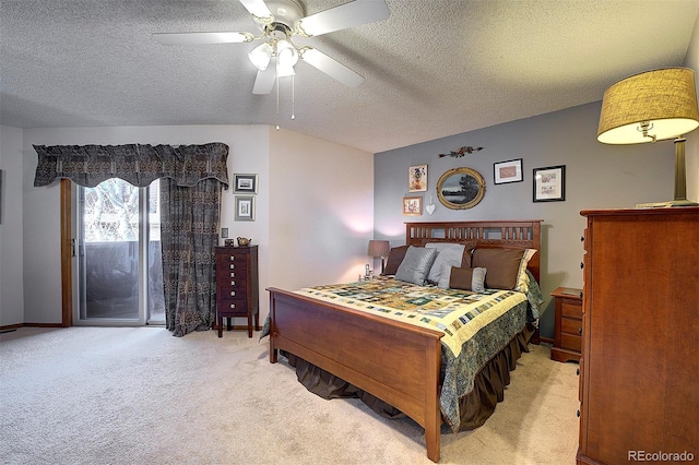 bedroom with carpet floors, access to exterior, vaulted ceiling, and a textured ceiling