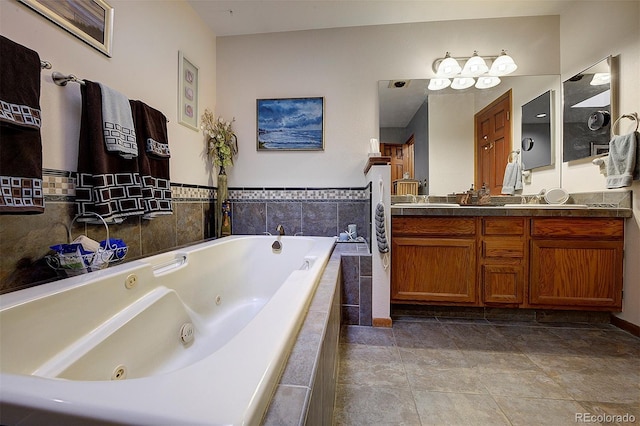 full bathroom with a whirlpool tub, double vanity, and tile patterned flooring