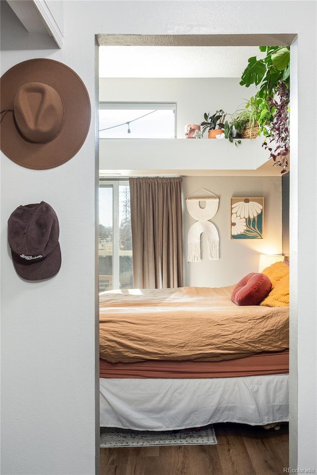 bedroom with wood finished floors