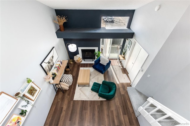 interior space with a fireplace and wood finished floors