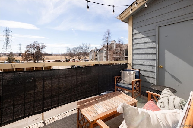 view of patio featuring a balcony