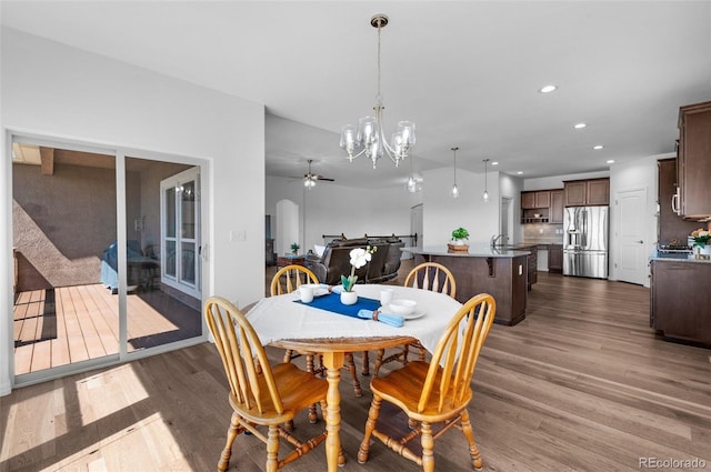 178 Coyote Willow, Colorado Springs, CO 80921 - dining space with dark wood finished floors, a chandelier, recessed lighting, and ceiling fan