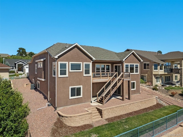 178 Coyote Willow, Colorado Springs, CO 80921 - rear view of property featuring stucco siding and stairs