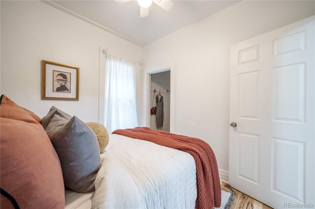 bedroom featuring light wood finished floors and ceiling fan
