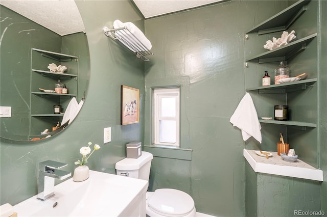 bathroom with toilet and a sink