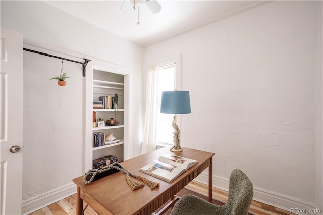 office with light wood-type flooring, baseboards, and ceiling fan