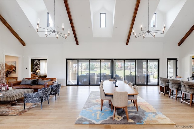 dining area featuring a notable chandelier, high vaulted ceiling, beamed ceiling, and light hardwood / wood-style floors