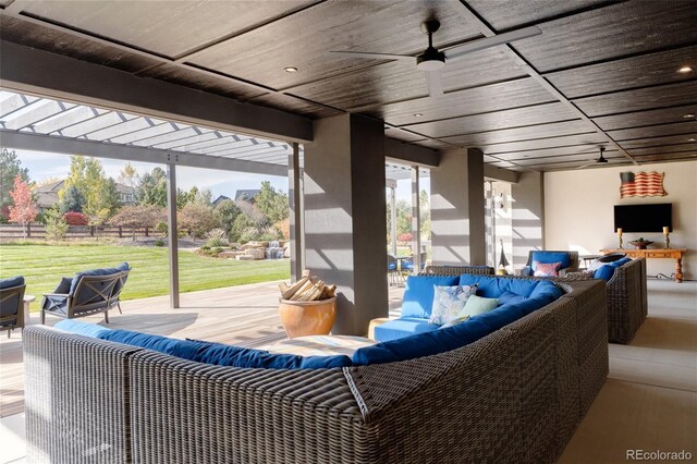 view of patio with an outdoor living space, ceiling fan, and a pergola