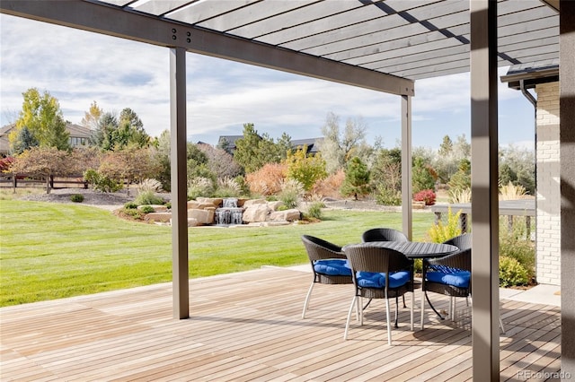 wooden deck with a pergola and a lawn