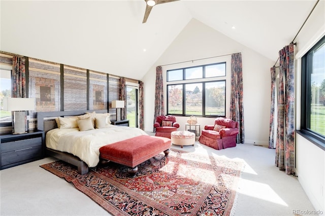 bedroom featuring ceiling fan, high vaulted ceiling, and light carpet