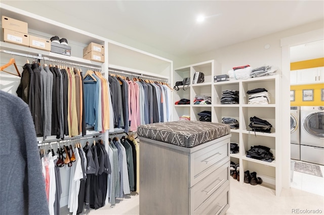 spacious closet featuring independent washer and dryer