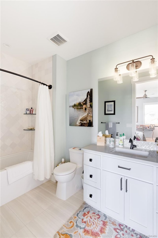 full bathroom featuring vanity, toilet, shower / bath combination with curtain, and ceiling fan