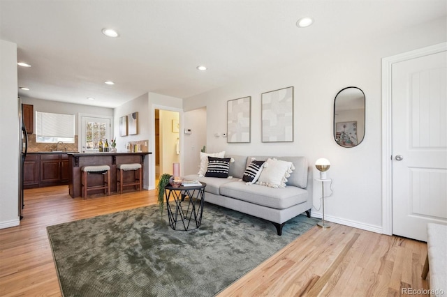 2285 Fulton St, Aurora, CO 80010 - living room with light wood-type flooring, recessed lighting, and baseboards
