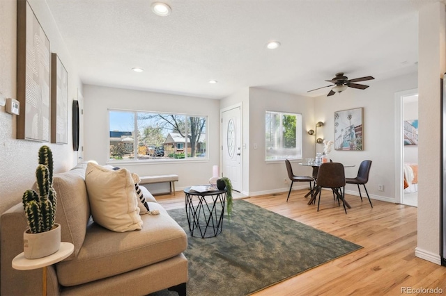 2285 Fulton St, Aurora, CO 80010 - living area with light wood-style floors, recessed lighting, baseboards, and a ceiling fan