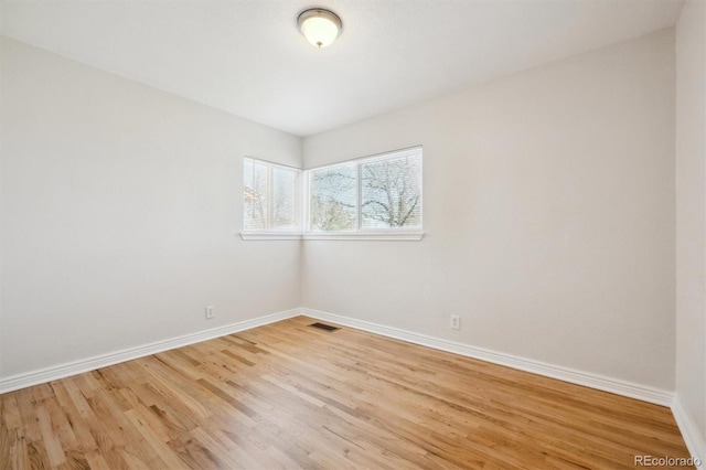2285 Fulton St, Aurora, CO 80010 - unfurnished room featuring baseboards and light wood finished floors