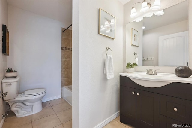 2285 Fulton St, Aurora, CO 80010 - bathroom featuring toilet, vanity, tile patterned floors, baseboards, and bathtub / shower combination