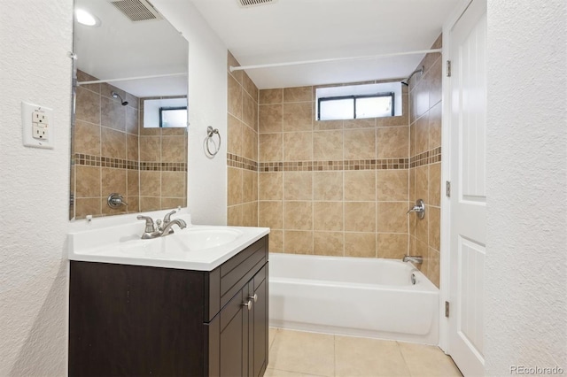 2285 Fulton St, Aurora, CO 80010 - bathroom with vanity, tile patterned floors, shower / washtub combination, and a textured wall