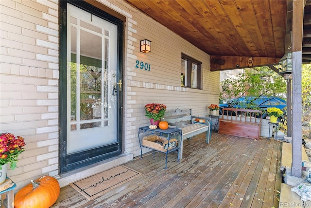 wooden terrace featuring a porch