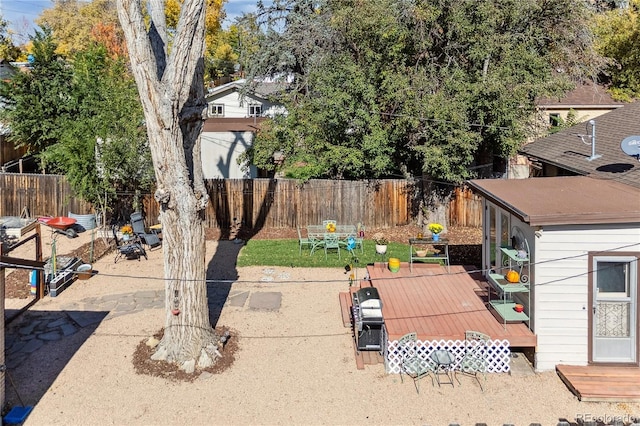 view of yard featuring a patio area and a wooden deck