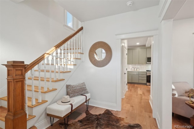 stairway featuring hardwood / wood-style floors