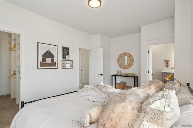 carpeted bedroom with ensuite bathroom