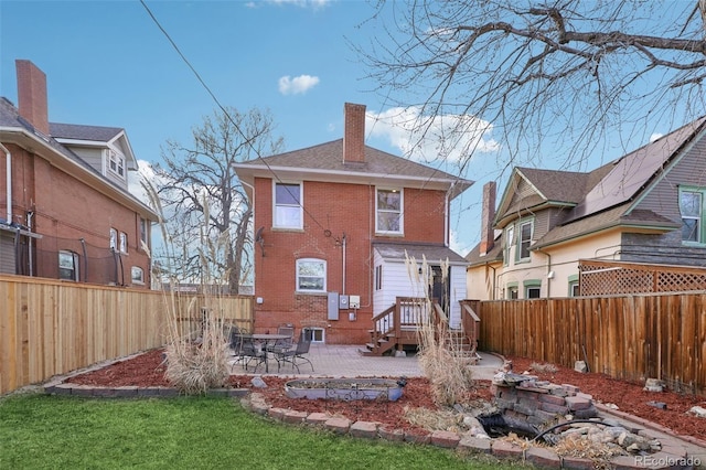 back of property with a patio