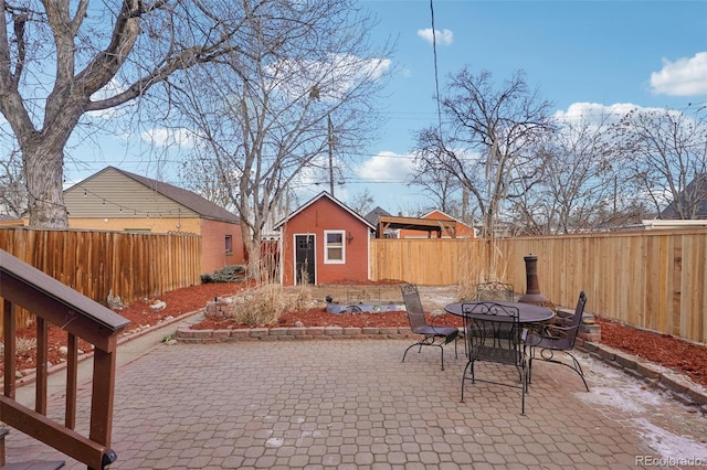 view of patio featuring an outbuilding