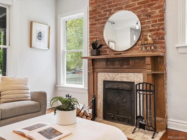 1423 Elizabeth St, Denver, CO 80206 - living area featuring baseboards, a fireplace, and wood finished floors