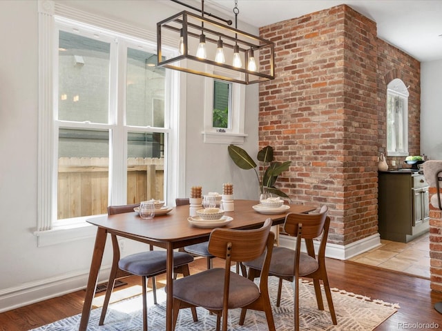 1423 Elizabeth St, Denver, CO 80206 - dining space featuring light wood-type flooring and baseboards