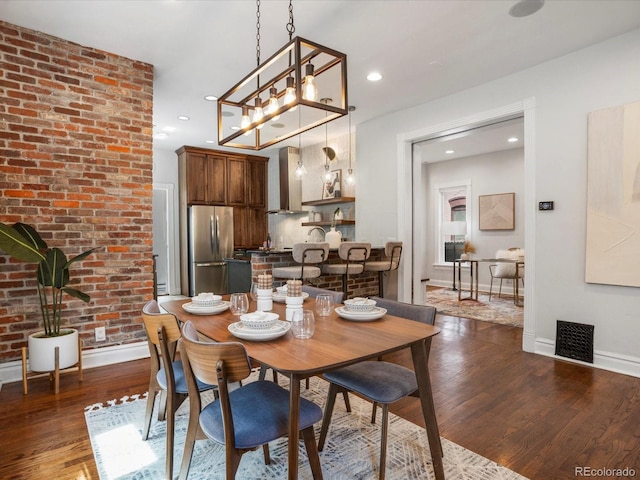 1423 Elizabeth St, Denver, CO 80206 - dining space featuring dark wood-style flooring, baseboards, and recessed lighting
