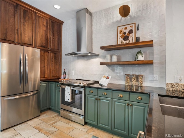 1423 Elizabeth St, Denver, CO 80206 - kitchen with stainless steel appliances, wall chimney range hood, green cabinetry, dark countertops, and recessed lighting