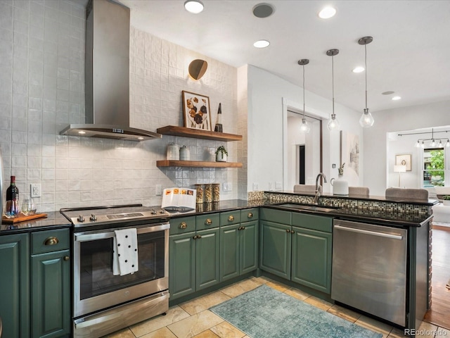1423 Elizabeth St, Denver, CO 80206 - kitchen featuring appliances with stainless steel finishes, wall chimney exhaust hood, green cabinetry, a sink, and tasteful backsplash