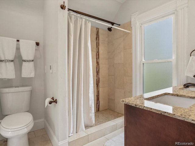1423 Elizabeth St, Denver, CO 80206 - full bath with a sink, tile patterned flooring, tiled shower, toilet, and baseboards