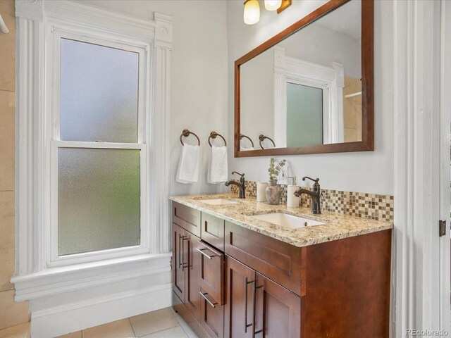 1423 Elizabeth St, Denver, CO 80206 - bathroom featuring double vanity and tile patterned flooring