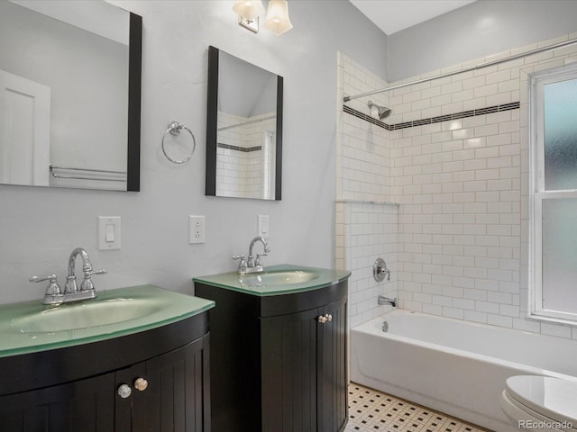 1423 Elizabeth St, Denver, CO 80206 - bathroom with shower / bathtub combination, two vanities, and toilet