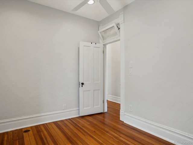 1423 Elizabeth St, Denver, CO 80206 - empty room featuring ceiling fan, dark wood-style floors, and baseboards