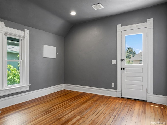 1423 Elizabeth St, Denver, CO 80206 - entryway featuring wood-type flooring, lofted ceiling, and baseboards