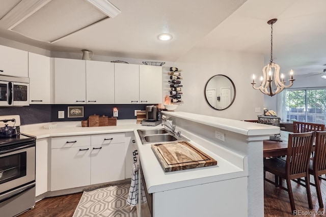 8767 E Dry Creek Rd Unit 1312, Englewood, CO 80112 - kitchen with appliances with stainless steel finishes, a sink, a peninsula, light countertops, and recessed lighting