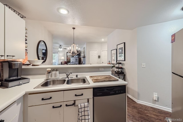 kitchen featuring white cabinetry, dishwasher, sink, hanging light fixtures, and dark wood-type flooring