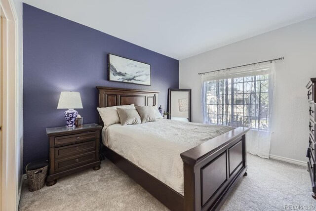8767 E Dry Creek Rd Unit 1312, Englewood, CO 80112 - bedroom featuring light colored carpet and baseboards