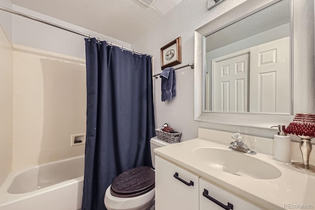 full bathroom featuring vanity, shower / tub combo, and toilet