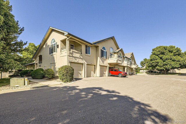 8767 E Dry Creek Rd Unit 1312, Englewood, CO 80112 - view of front of property featuring stucco siding and an attached garage
