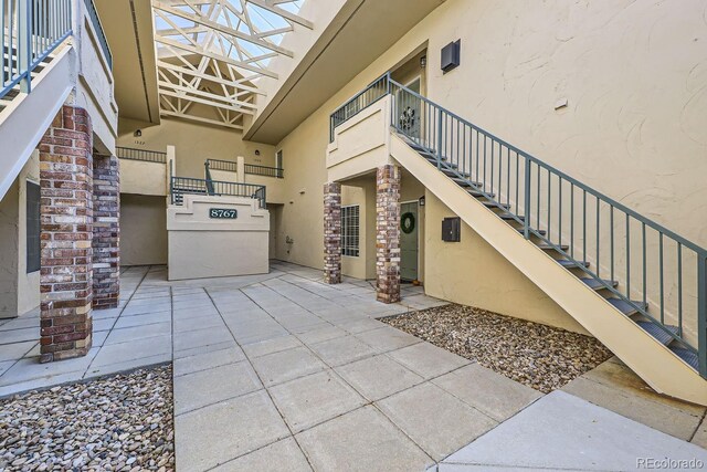 8767 E Dry Creek Rd Unit 1312, Englewood, CO 80112 - doorway to property with stucco siding